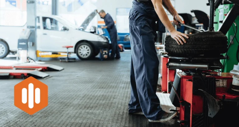 Car Mechanic Changing Tires