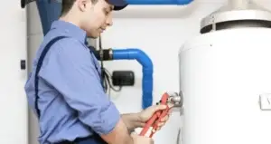 man fixing a Water Heater
