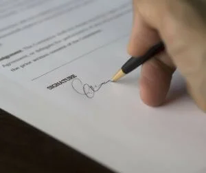 hand signature on a paper
