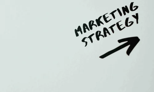 words ''marketing strategy'' with an arrow pointing in the right direction