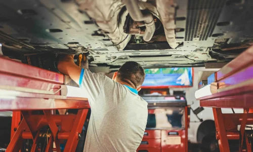 the worker fixing the machines