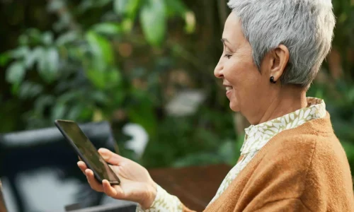 elderly woman using her phone