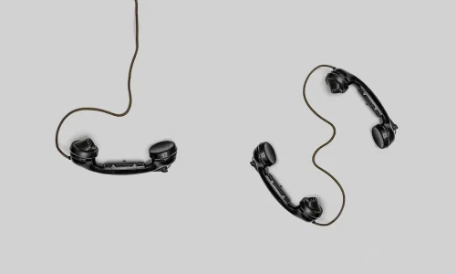 three phones with a cord