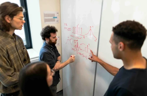 three coworkers analyzing data on the table