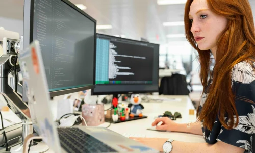 Woman looking at the monitor for phone calls